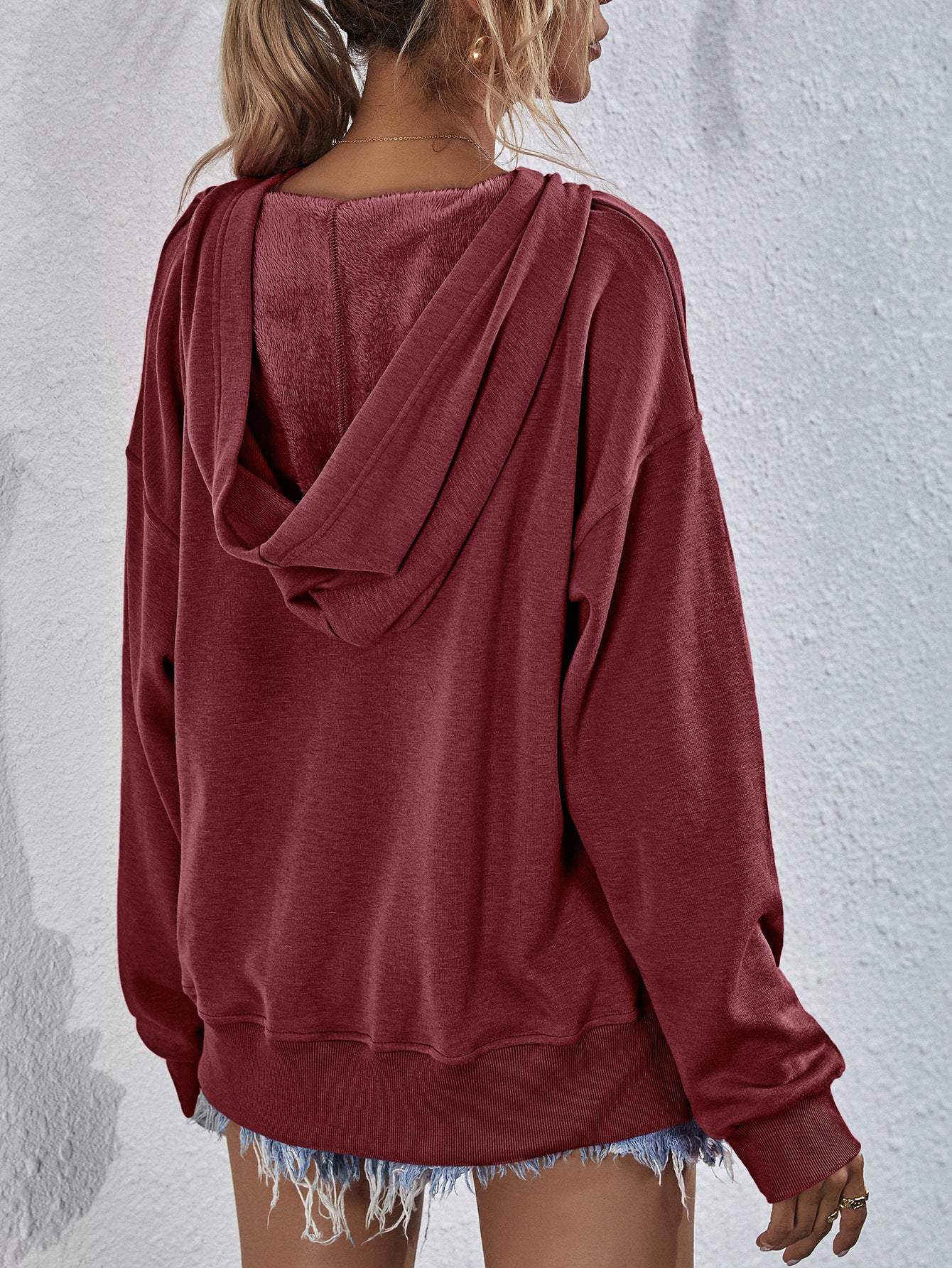 Boxy wine hooded sweatshirt with plush lining and split hem detail.