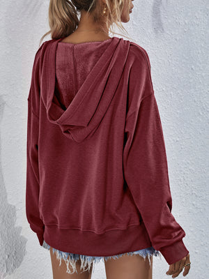 Boxy wine hooded sweatshirt with plush lining and split hem detail.