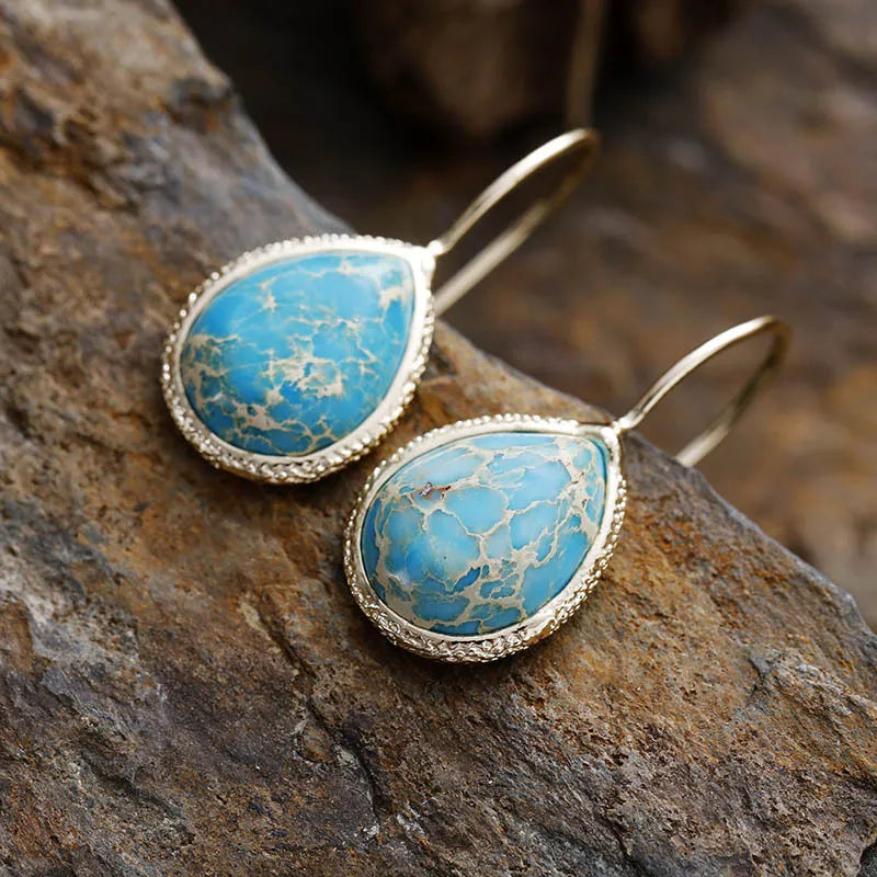 Pastel blue marbled gemstone teardrop earrings with 18K gold-plated bezel.