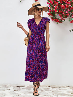 Blue purple floral wrap midi dress with flutter sleeves and belted waist.