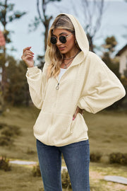 Ivory textured cable knit zip-up hoodie with pockets and a hood.