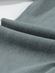 Textured ribbed leggings in dark gray, showing fabric detail.