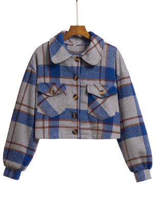 Chic plaid jacket in dark blue and gray with buttoned chest pockets and collar.