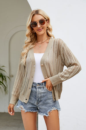 Khaki openwork knit button-down cardigan with V-neck and long sleeves, styled with a white tank and denim shorts.