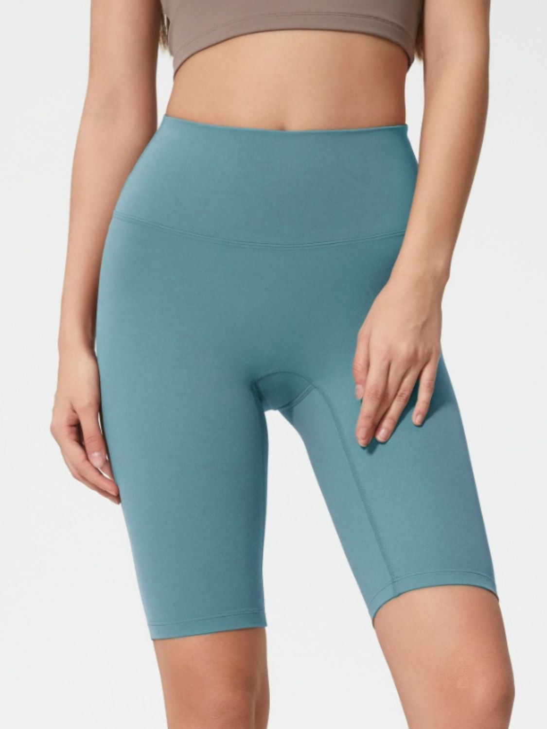 Sculpted active bike shorts in Teal with a high waist and seamless design.
