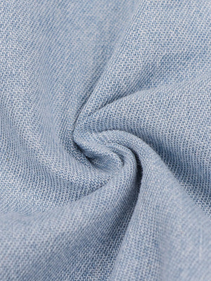 Light wash denim mini dress with a textured weave and a zipper front detail.