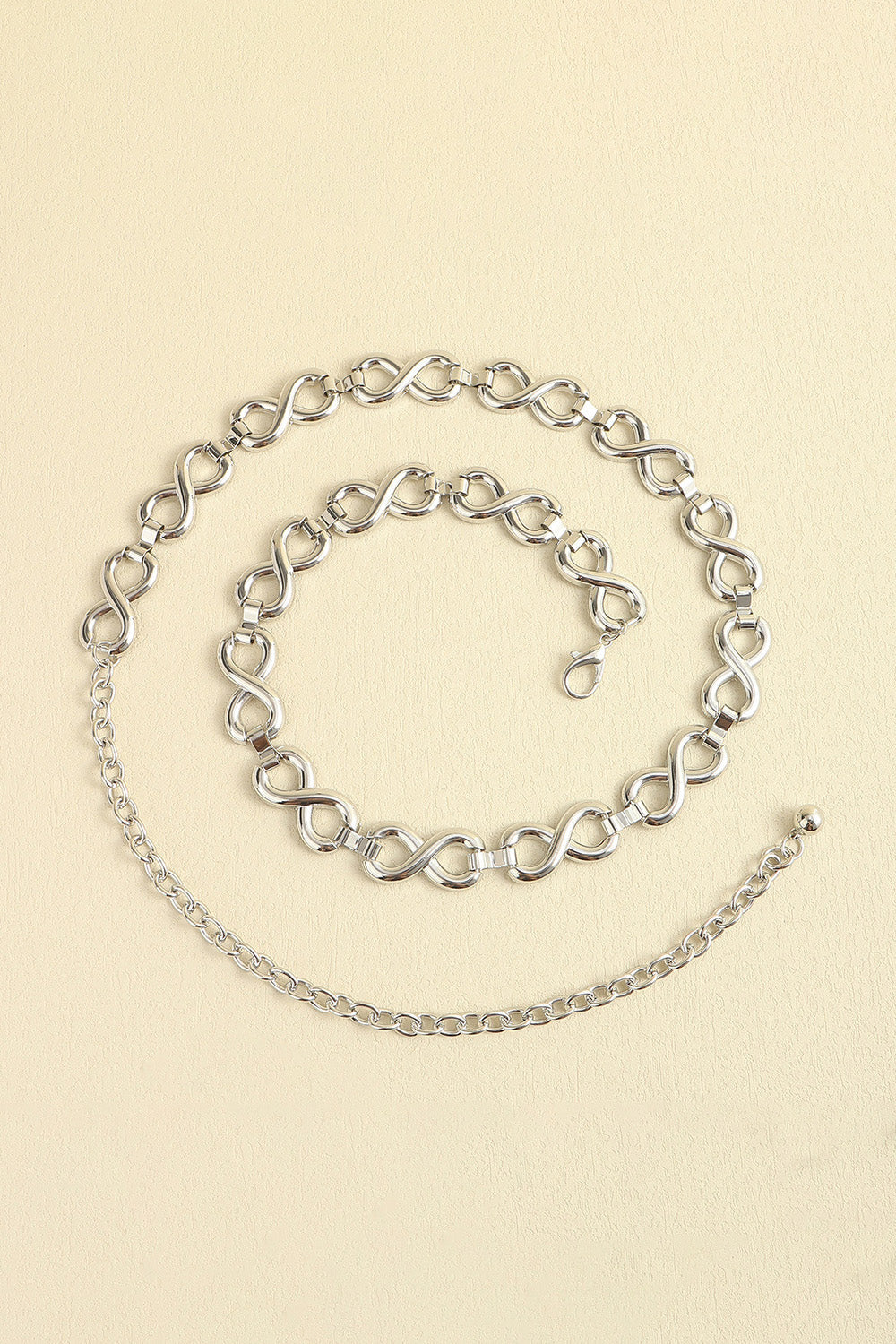 Silver infinity chain waist belt with lobster clasp and extender chain.