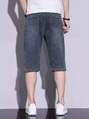 Men's classic washed denim shorts in dusty blue with button closure and back pockets.