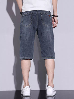 Men's classic washed denim shorts in dusty blue with button closure and back pockets.