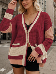 Burgundy waffle knit colorblock V-neck cardigan with button front and pockets.