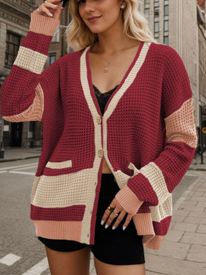 Burgundy waffle knit colorblock V-neck cardigan with button front and pockets.