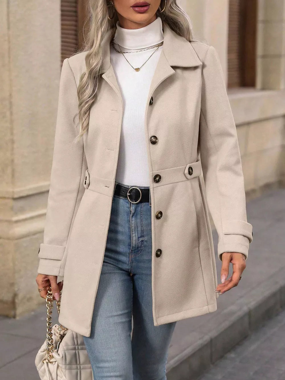 Elegant button-up trench coat in camel with cinched waist and button details.