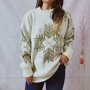 Cream acrylic sweater with gold snowflake embellishments and a crew neck.