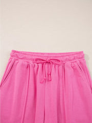 Hot pink casual pants with elastic waistband and drawstring detail