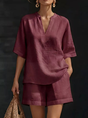 Notched V-neck two-piece set in dark red with pockets and short sleeves.