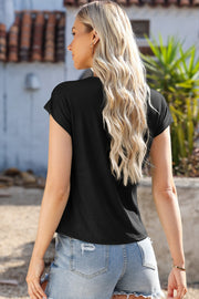 Black cowl neck cap-sleeve tee shirt with a casual fit.