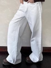 Belted wide leg white cotton jeans with a classic cut.