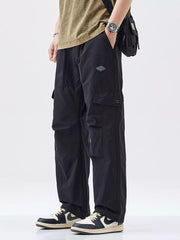 Black oversized cargo pants with multiple pockets and adjustable waist