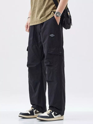 Black oversized cargo pants with multiple pockets and adjustable waist