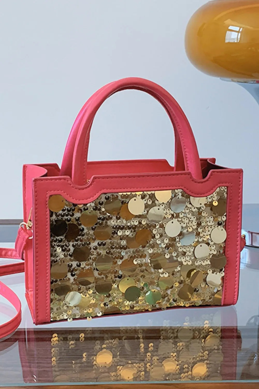 Hot Pink structured mini bag with gold sequin embellishments and top handles.