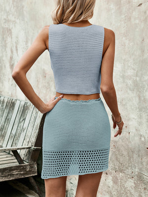 Light blue crochet vest and mini skirt set with openwork hem detail.
