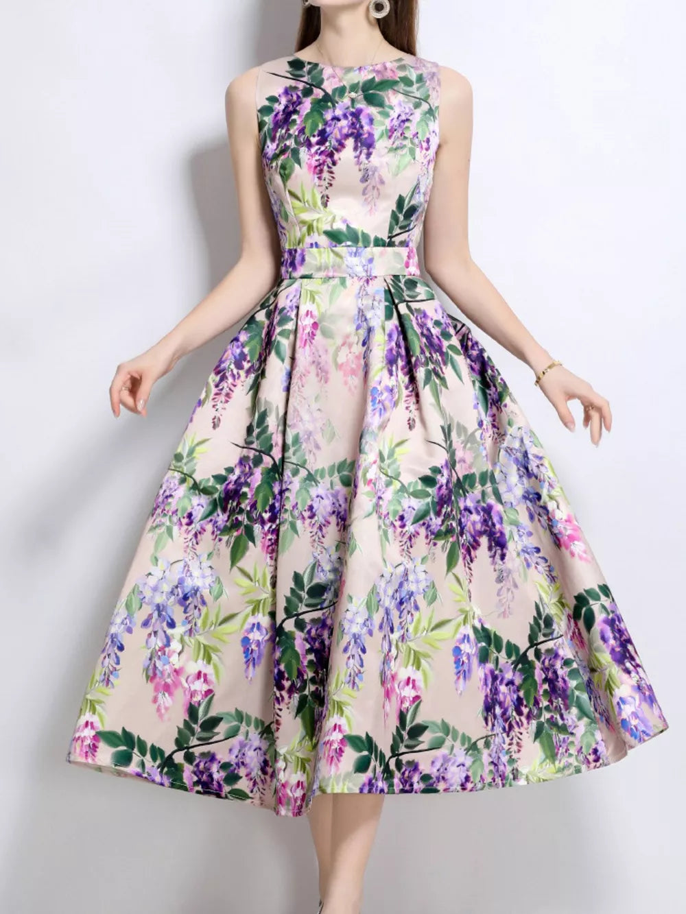 Wisteria floral print midi dress in blush pink with a-line cut and sleeveless design.