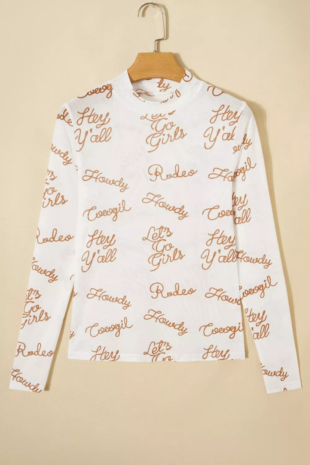White sheer long sleeve shirt with all-over brown text print and high neckline.