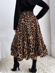 Leopard print midi skirt with tiered ruffles and elastic waistband.