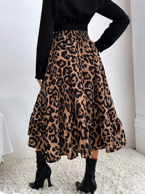 Leopard print midi skirt with tiered ruffles and elastic waistband.