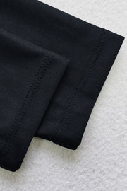 Black sporty legging swimsuit with ribbed texture and zip detail.