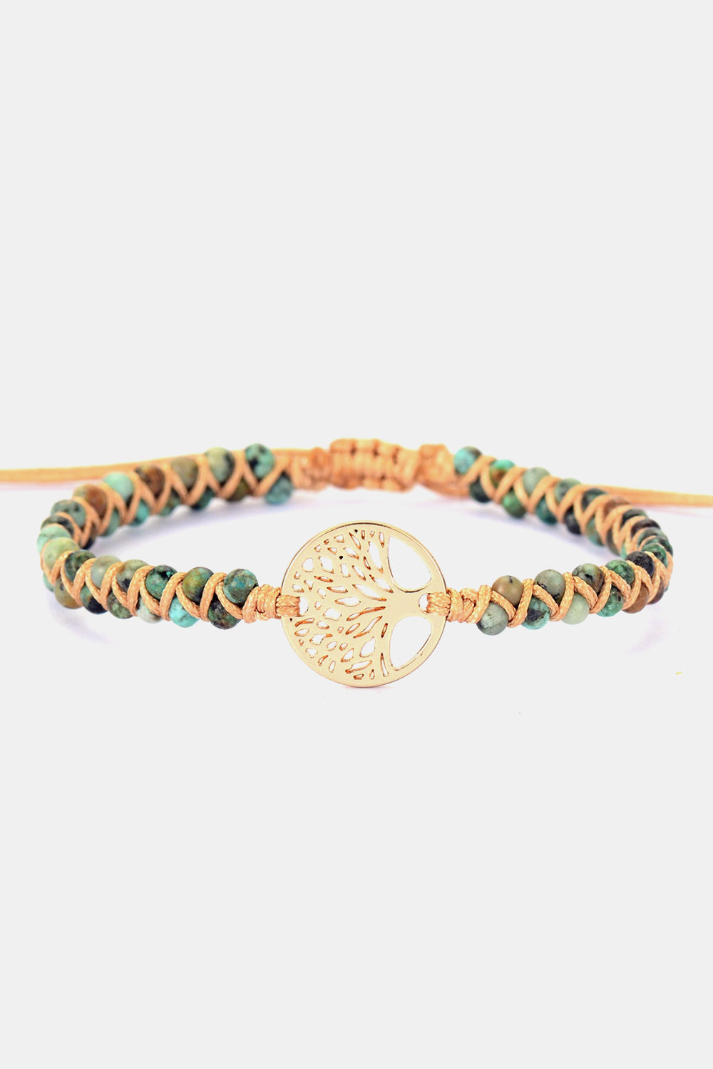 Gold Tree of Life macrame bracelet with turquoise beads and macrame cord.