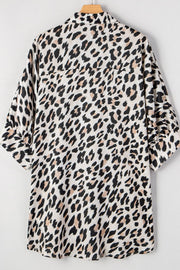 Leopard print oversized button-down blouse with cuffed sleeves.