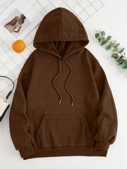 Oversized chocolate brown hoodie with pouch pocket and drawstring hood.
