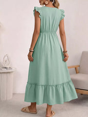 Maternity maxi dress in mint green with ruffled short sleeves, empire waist, and tiered ruffled hem.