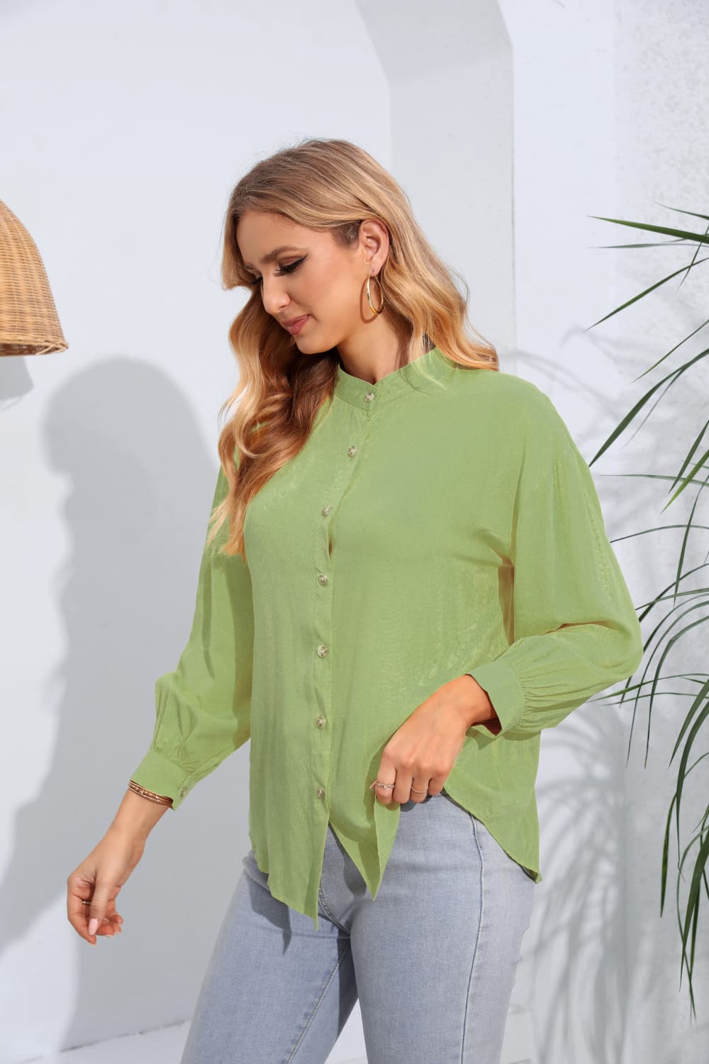 Light green mandarin collar blouse with button front and gathered sleeves.