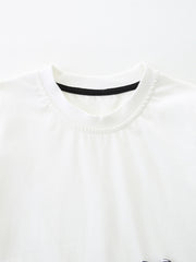 White cotton baby tee with black trim neckline, part of a zebra graphic set.