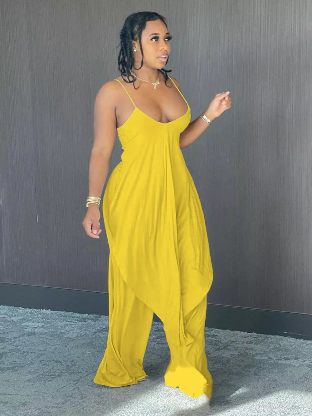 Yellow cami and wide-leg pants set with asymmetrical draped hem and spaghetti straps.