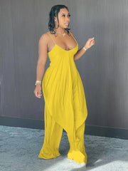 Yellow cami and wide-leg pants set with asymmetrical draped hem and spaghetti straps.