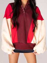 Oversized color block sweatshirt with button neck in red, brown, and cream cotton.