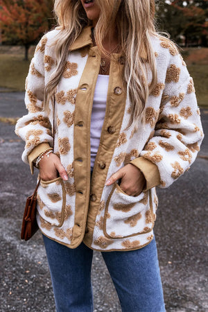 Floral sherpa jacket with corduroy trim and button closure.