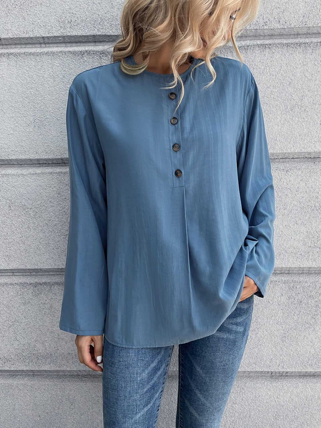 Dusty blue mandarin collar button-down blouse with a relaxed fit and subtle vertical texture.