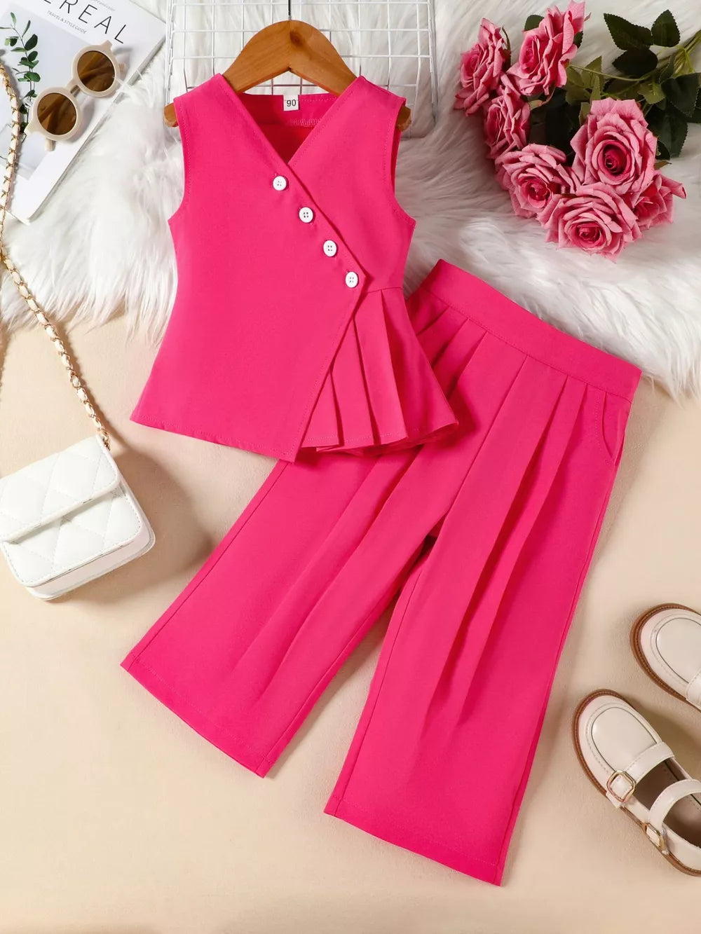 Pink baby girl outfit with pleated detail top and wide-leg pants