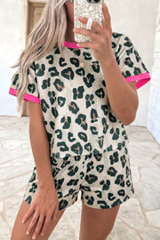 Leopard print pajama set with pink trim, polyester, short sleeve top and shorts