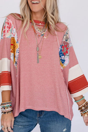 Patchwork stripe raglan tee in deep red with colorful boho sleeve panels and striped cuffs.