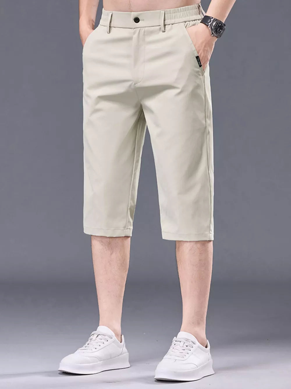 Men's apricot chino shorts with belt loops and pockets.