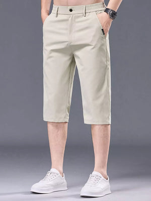 Men's apricot chino shorts with belt loops and pockets.