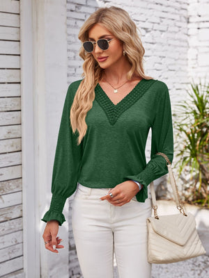 Dark green lace trim v-neck blouse with blouson sleeves and smocked cuffs.