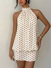 Apricot polka dot halter mini dress with gathered neckline and layered hem