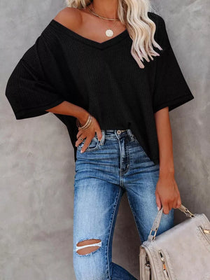 Black waffle knit relaxed v-neck t-shirt with short sleeves.