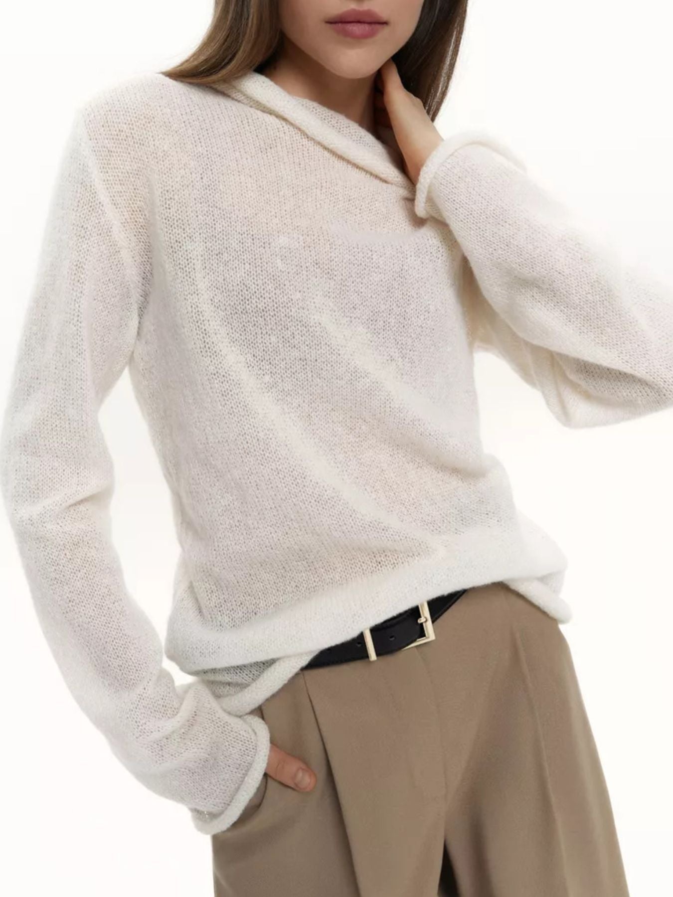 Sheer white mock neck knit sweater with draped neckline and long sleeves.